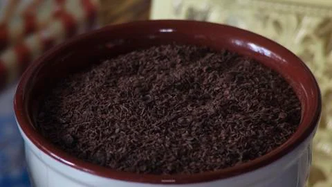 Grated chocolate in a cup Stock Photos
