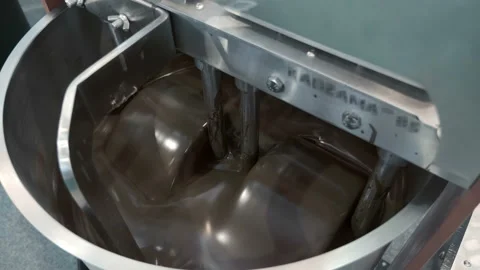 Grated cocoa is subjected to long-term continuous intensive stirring  Stock Footage 167567116