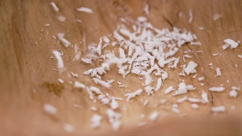 Close up of man hand grated coconut using an electric coconut grater in  Thailand Stock Photo