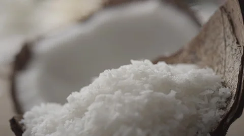 Grated coconut pouring on coconut shell Stock Footage 67021824