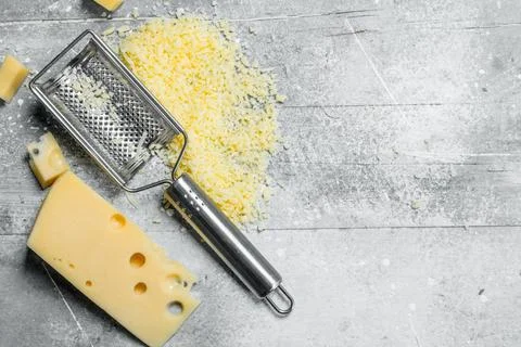 Grated fresh cheese. Stock Photos