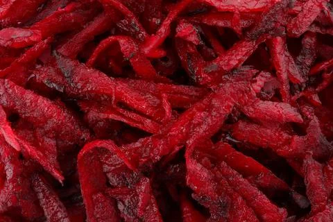 Grated fresh red beet as background, closeup view Stock Photos