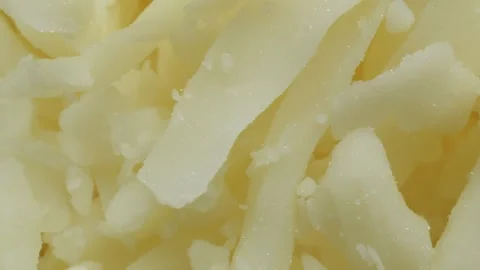 Grated mozzarella cheese extreme macro close up with a rotating camera moti.. Stock-Footage 328594516