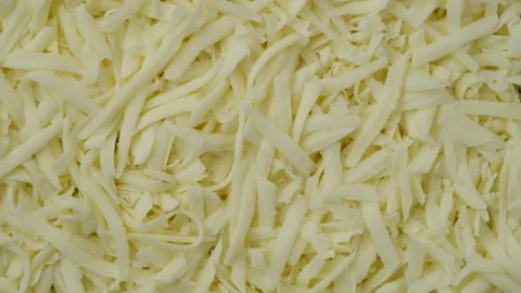 Grated mozzarella cheese top view. Sliding shot. pizza grated mozzarella cheese 스톡 동영상 153588861