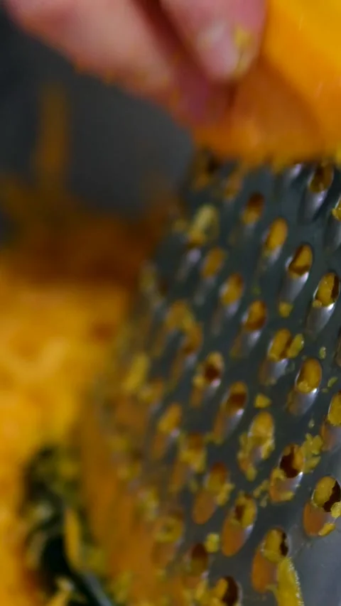 Grated orange carrots on the table during cooking, sweet ripe orange carrots Video stock 302184560