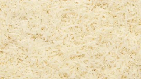 Grated parmesan - background. Cheese, top view. Video stock 143009897