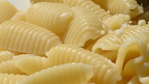 Grated Parmesan Cheese Sprinkled on Pasta Close Up Stock Footage 337322048
