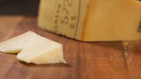 Grated Parmesan Falls on a Piece of Parmesan Closeup No. 2 Stock Footage 99164603