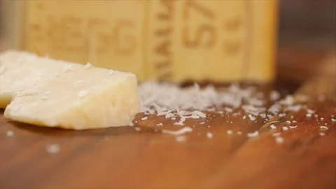 Grated Parmesan Falls on a Piece of Parmesan Closeup No. 1 Stock Footage 99164641