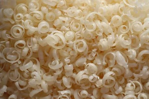 Grated piece of natural laundry soap for washing clothes by hand Stock Photos