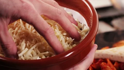 Grated pizza cheese mozarella close up, chef hand touching cheese for Italian Stock Footage 231929103
