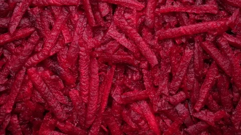 Grated raw beets top view, rotation Stock-Footage 233879325