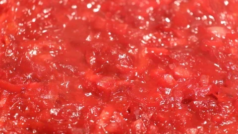 Grated vegetables boil in tomato paste and steam goes Video stock 98295143