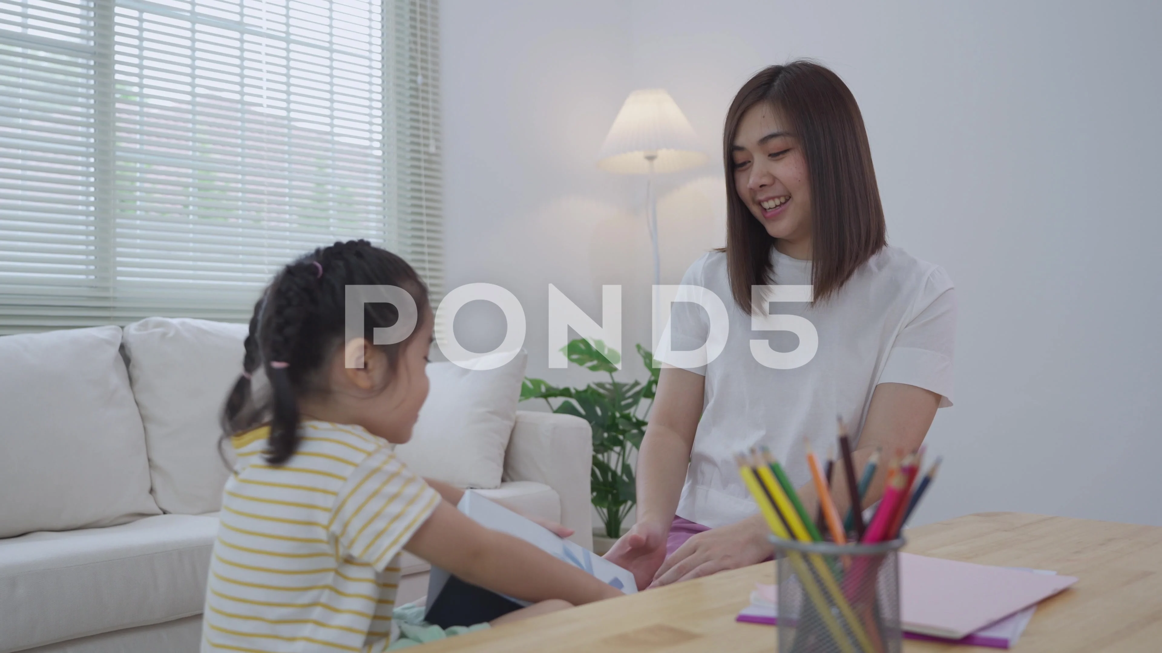 https://images.pond5.com/grateful-asian-girl-holding-blue-footage-248992574_prevstill.jpeg