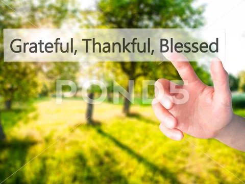 Grateful Thankful Blessed - Hand pressing a button on blurred ba Stock Photos