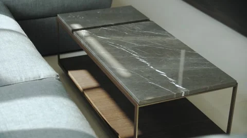Gratin rectangular coffee table next to the sofa in the living room Vídeos de archivo 273496000