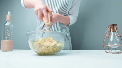 Grating and sprinkling parmesan cheese on freshly made Caesar Salad in 4K. Stock Footage 140768592