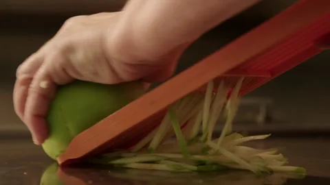 Grating an apple Stock Footage 245468741