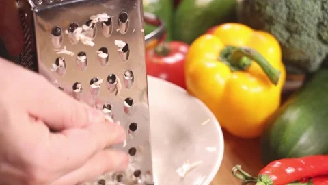 Grating campignons on a table full of vegetables. Stock-Footage 144023030