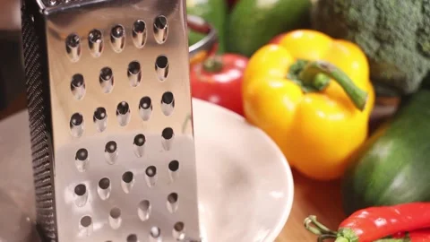 Grating campignons on a table full of vegetables. Stock Footage 144023352