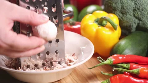 Grating campignons on a table full of vegetables. Video stock 144023412