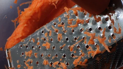 Grating carrot for cake Stock Footage 107633298