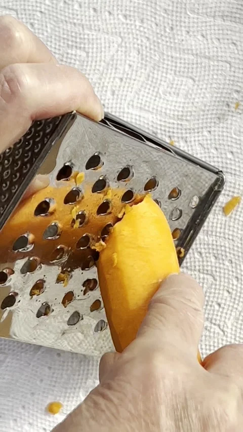Grating a carrot vertical Stock Footage 223182294