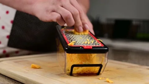 Grating Cheddar Cheese Stock-Footage 138476395