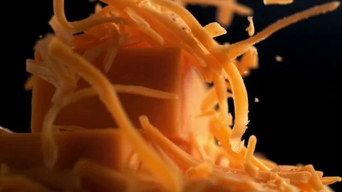 Grating cheddar cheese. Slow Motion. Stock Footage 84939658