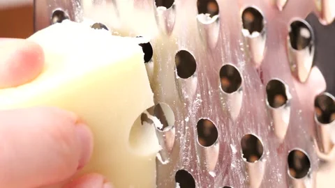 Grating cheese block in slow motion Stock Footage 306195158