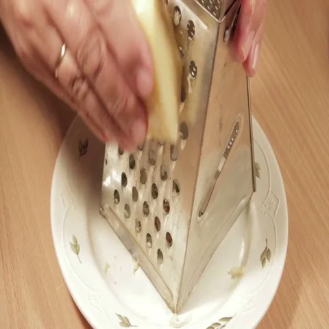 Grating cheese close up. Close up shot. Stock Footage 69413115