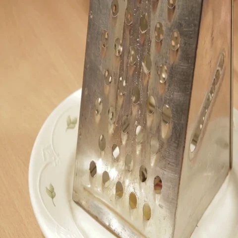 Grating cheese close up. Close up shot. Stock Footage 69413384