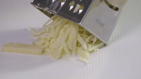 Grating cheese; close-up Stock Footage 64021874