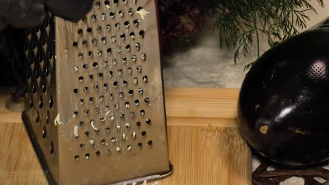 Grating Cheese in Close-Up  Soft Texture and Culinary Mood Stock Footage 311543905