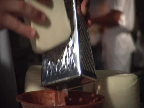 Grating cheese, with cook bg, static -alt Stock Footage 26190001