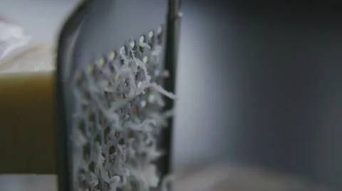 Grating cheese slow motion Stock Footage 57638736