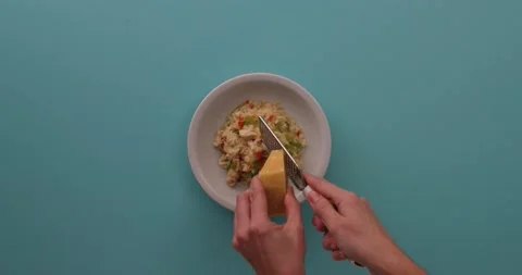 Grating cheese on top of chicken stir fry 1 Video stock 132199042