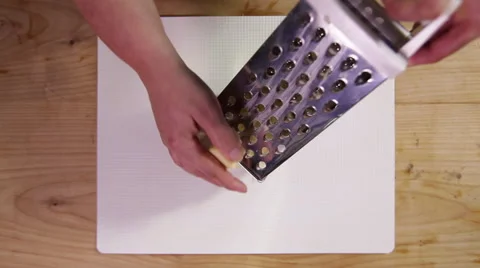 Grating cheese; top-shot, high-shot Stock Footage 64022946