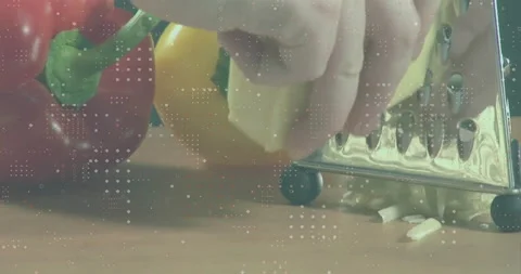 Grating cheese with vegetables in background, data processing animation overlay Stock Footage 304310638