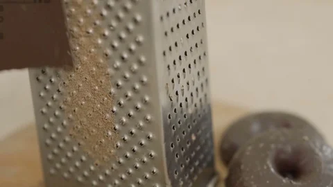 Grating chocolate in slowmotion Stock Footage 85279218