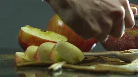 Grating cinnamon stick with apples Stock Footage 67359184