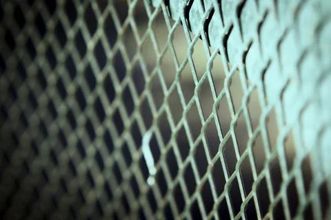 Grating with defocused rhombus shaped background Foto stock