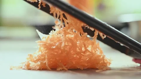 Grating fresh carrot with a grater in the kitchen. Stock Footage 168146345