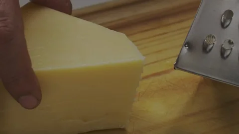 Grating fresh cheese Stock Footage 98296044