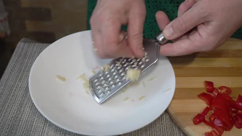 Grating Of Garlic By A Grater. Stock-Footage 315985025