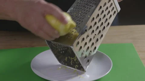 Grating a lemon Stock Footage 64014945