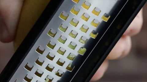 Grating off Lemon Peel Closeup Stock Footage 99165952