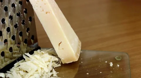 Grating Parmesan Cheese with Grater Stock Footage 49653069