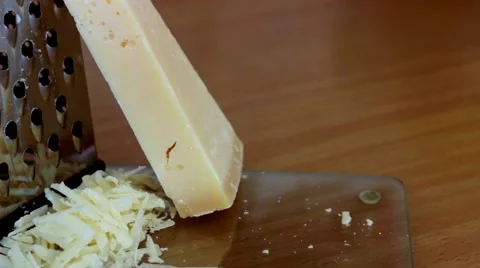 Grating Parmesan Cheese with Grater Stock Footage 49653090