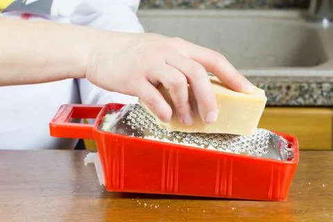 Grating Parmesan cheese Stock Photos